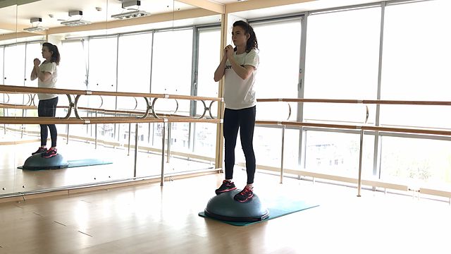 Photo of BOSU squat exercise