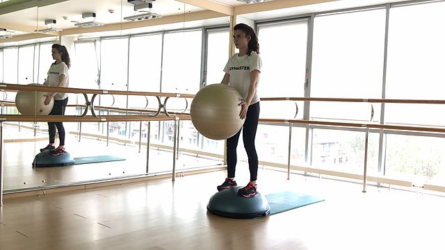 Photo of BOSU squats and twist with the fitball exercise