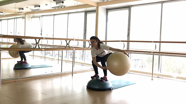 Photo of BOSU squats and twist with the fitball exercise