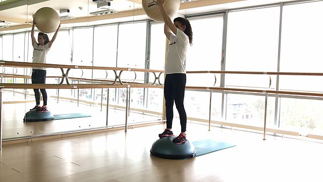 Photo of BOSU squats and twist with the fitball exercise