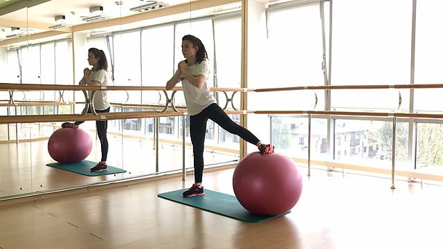 Photo of Side lunge with a fitball exercise