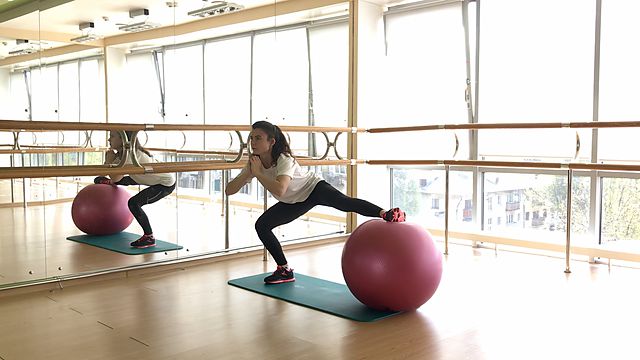 Photo of Side lunge with a fitball exercise