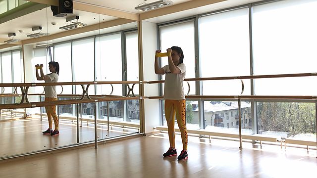 Photo of Hands horizontal abduction using a mini loop exercise