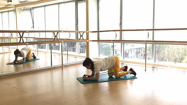 Photo of Leg back abduction on all fours with resistance band exercise