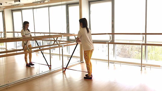 Photo of Leg back abduction with a rubber band exercise