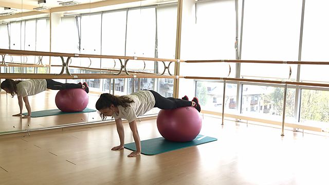 Photo of Stepping hands lying on a fitball exercise