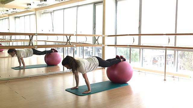 Photo of Raising a leg from plank on fitball exercise