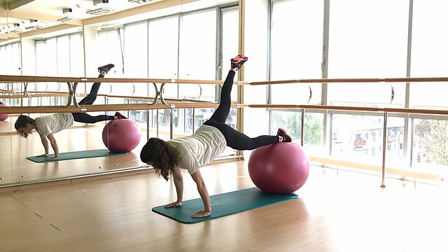 Photo of Raising a leg from plank on fitball exercise