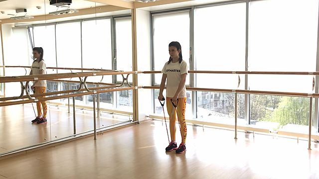 Photo of Hands front raises using resistance band exercise