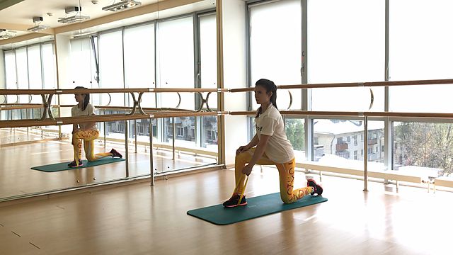 Photo of One-handed pull in lunge with a mini band exercise