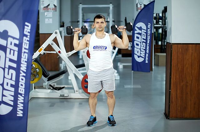 Photo of Standing Dumbbell Press exercise