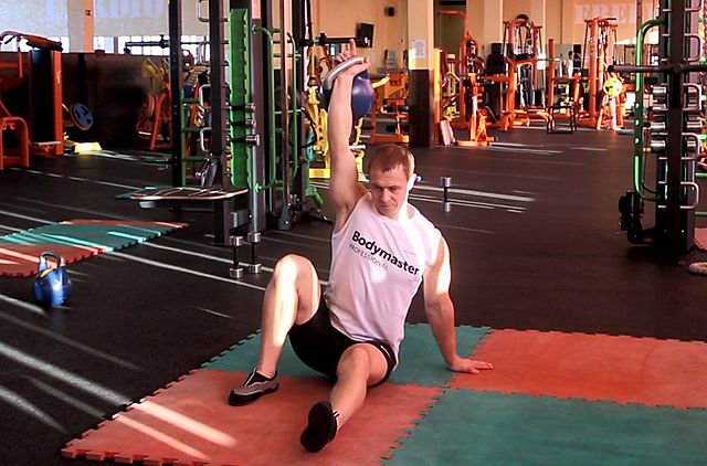 Photo of Kettlebell Turkish Get-Up (Squat style) exercise