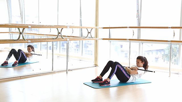 Photo of Fixed crunches with bodybar exercise
