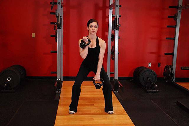 Photo of Double Kettlebell Alternating Hang Clean exercise