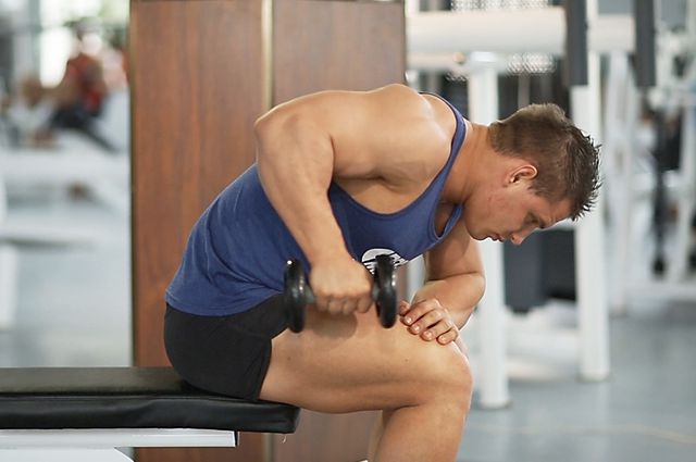 Photo of Seated Bent-Over One-Arm Dumbbell Triceps Extension exercise