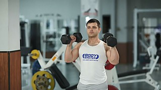 Standing Palms-In Dumbbell Press 
