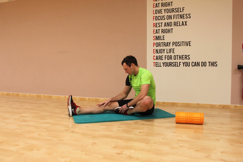 Seated Floor Hamstring Stretch how to do it video of performing technique AtletIQ