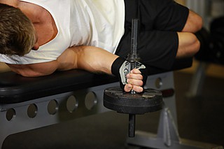 palms down wrist curl over a bench