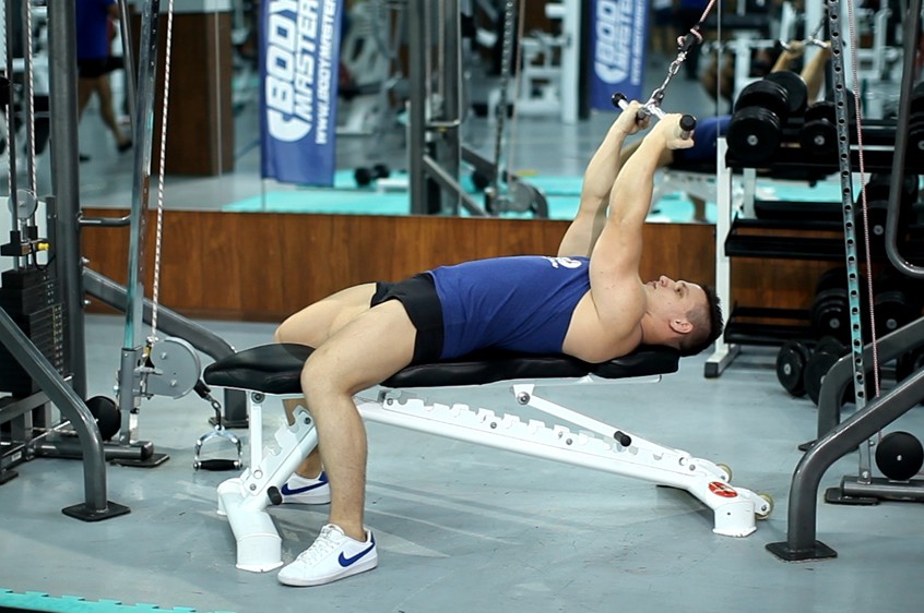 Exercise Lying Close-Grip Bar Curl On High Pulley