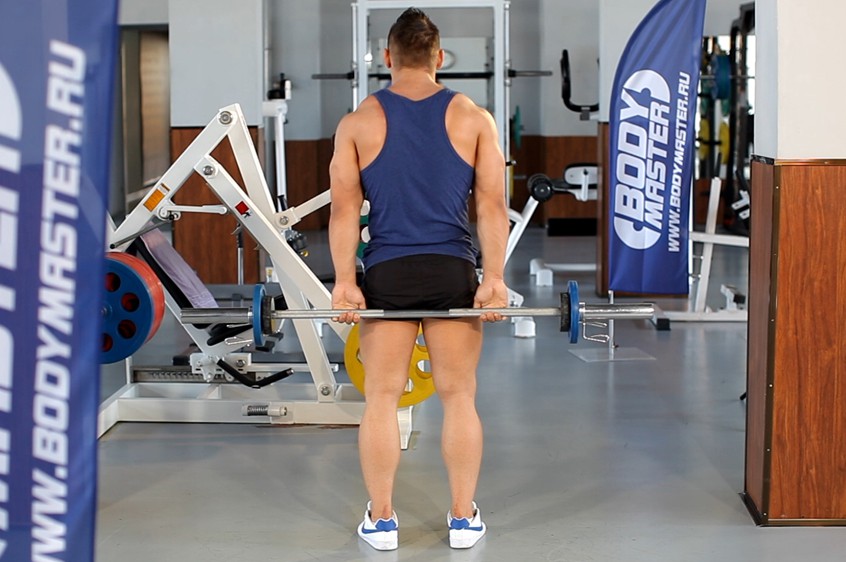 Standing PalmsUp Barbell Behind The Back Wrist Curl — how to do it