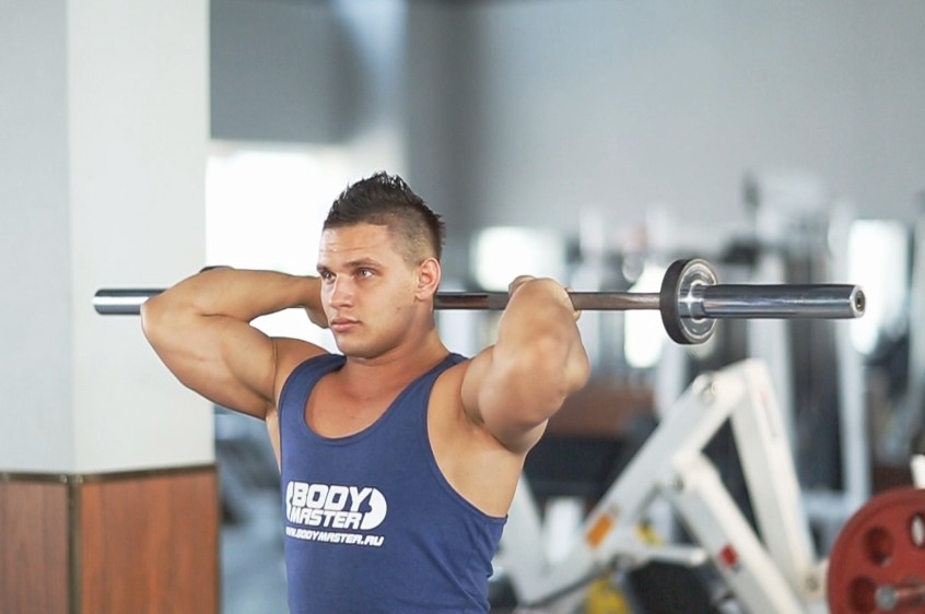 Exercise Standing Overhead Barbell Triceps Extension