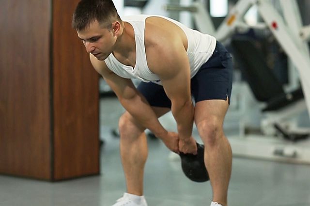 Photo of Kettlebell Pass Between The Legs exercise